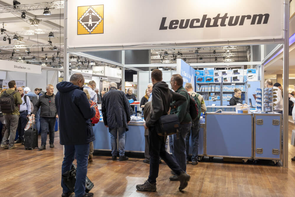 Visitors found collecting equipment at the Leuchtturm stand. Photo: World Money Fair.